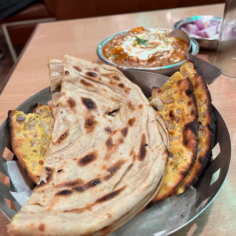 What should Jain travellers confirm before ordering?
