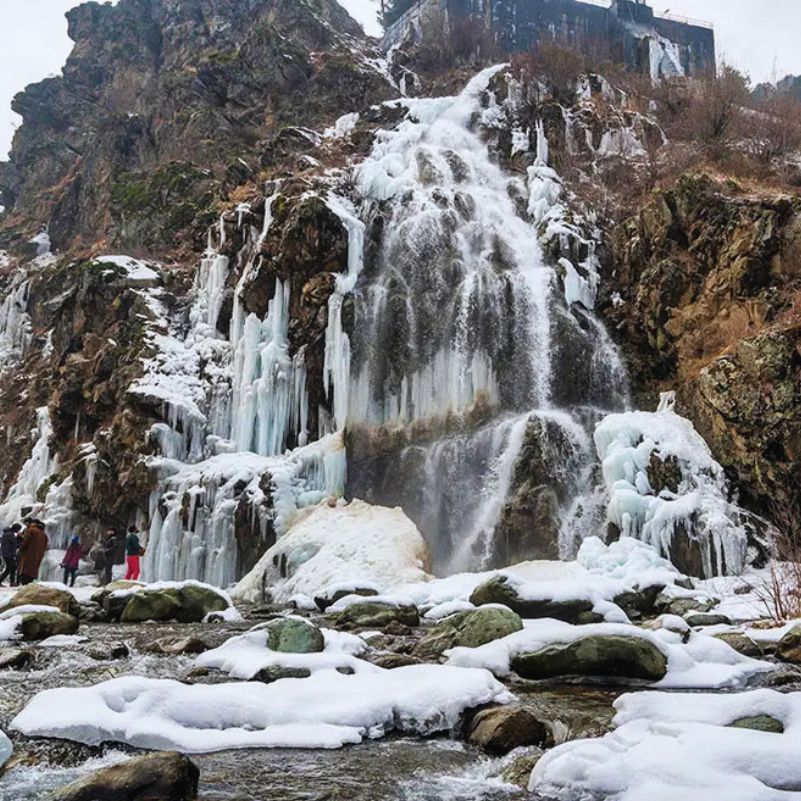 Scenic winter view of Drung Waterfall near Tangmarg and Gulmarg.jpg