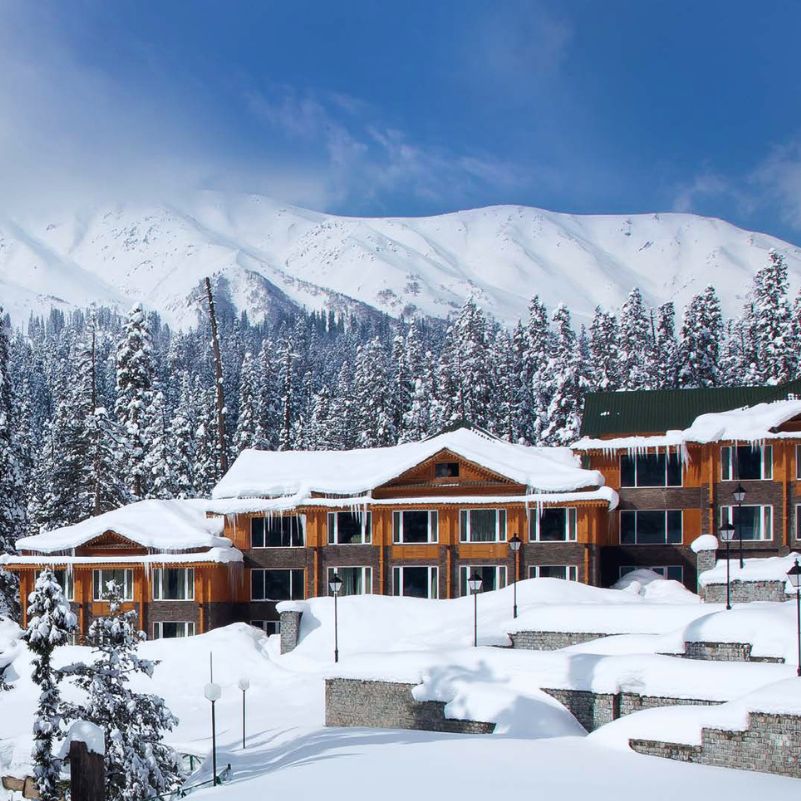 Snow-covered rooftops and traditional wooden houses in Srinagar.jpg