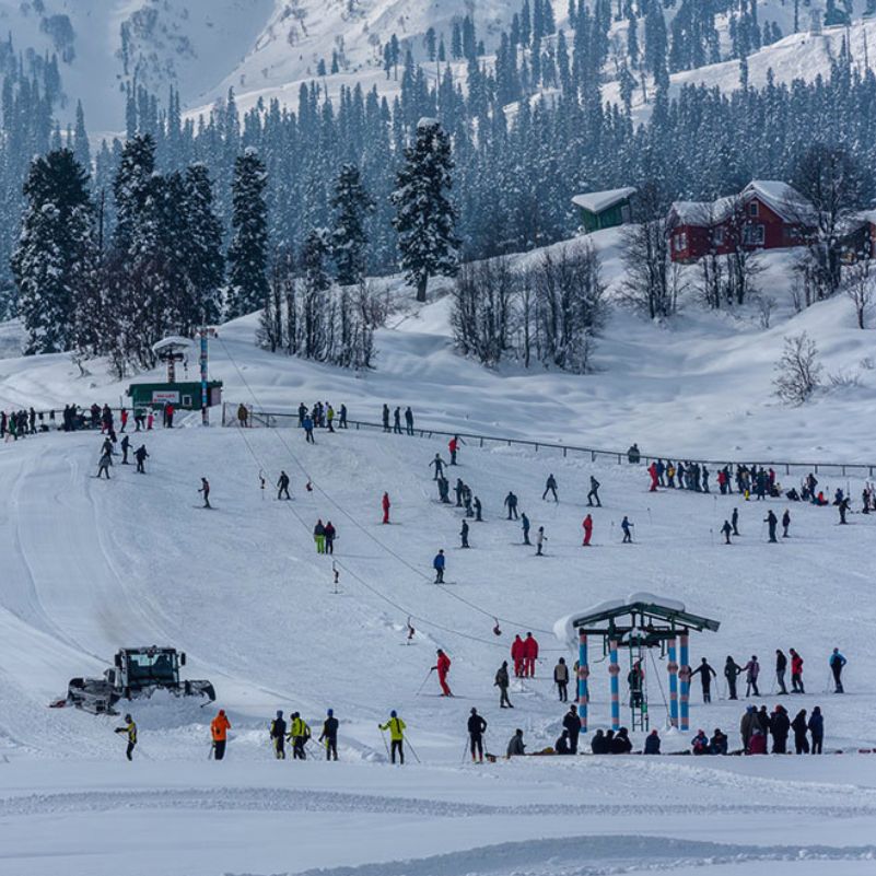 Tourists enjoying fresh snowfall during a winter trip to Gulmarg Kashmir.jpg