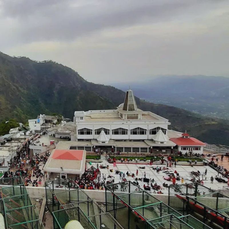 Vaishno Devi Temple illuminated with beautiful lights during the evening.jpg