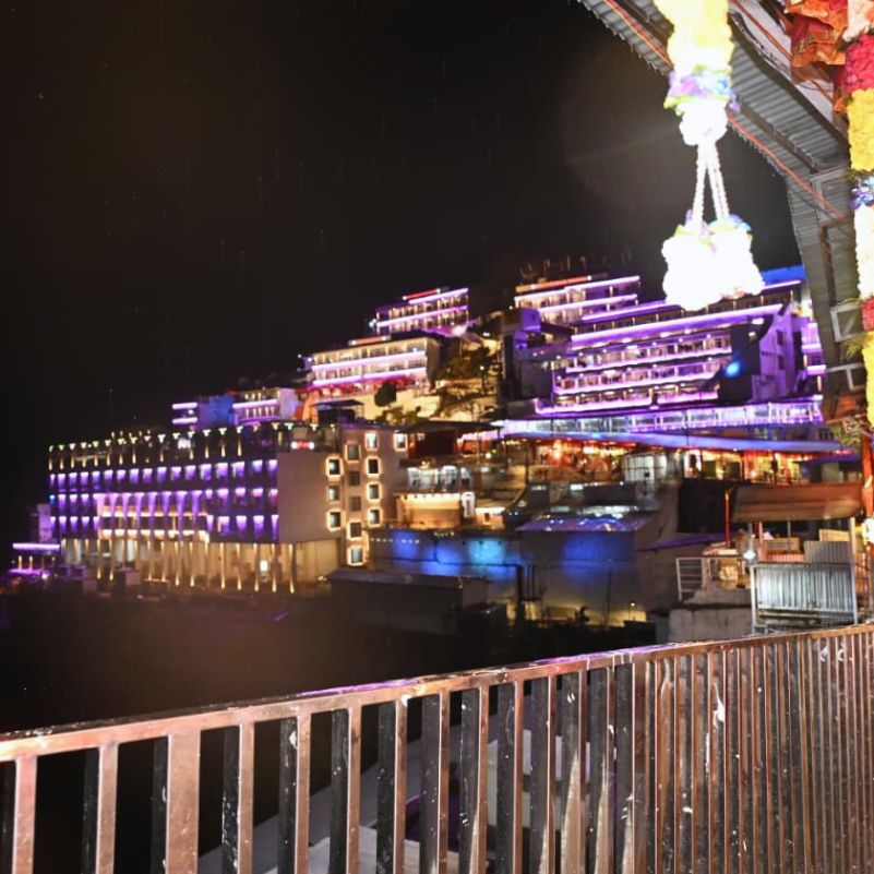 Sacred Vaishno Devi Bhawan surrounded by beautiful mountain scenery.jpg