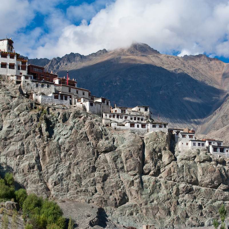 Sunlit Diskit Monastery in the mountains of Ladakh.jpg