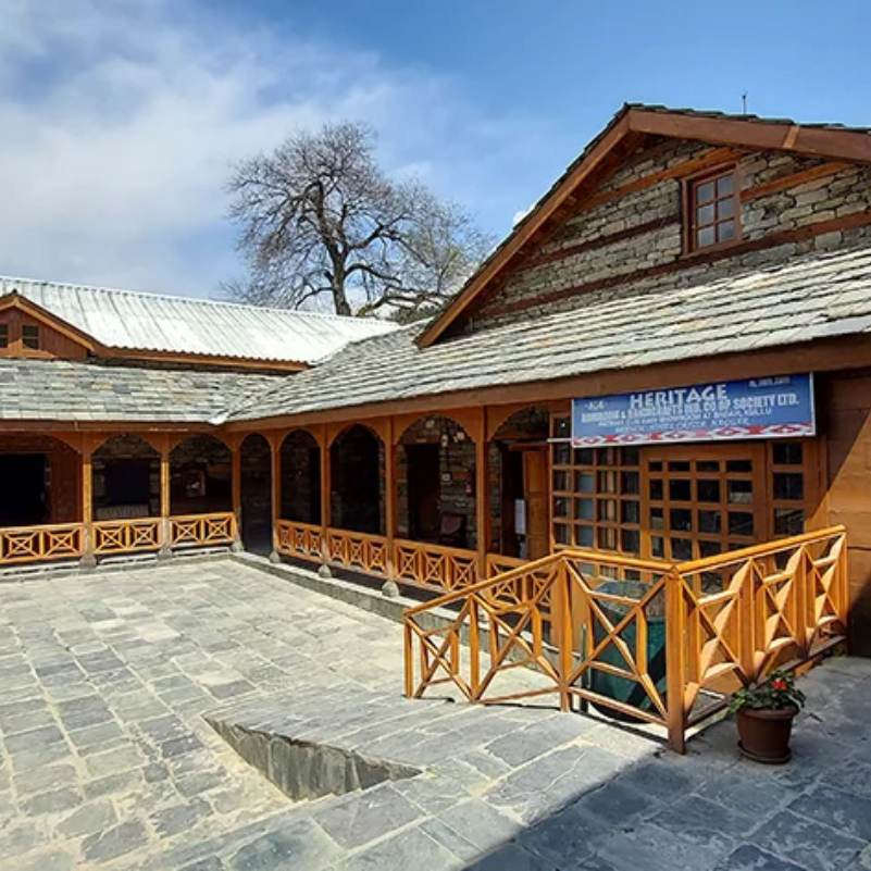 Naggar Castle overlooking the green valley with mountains beyond