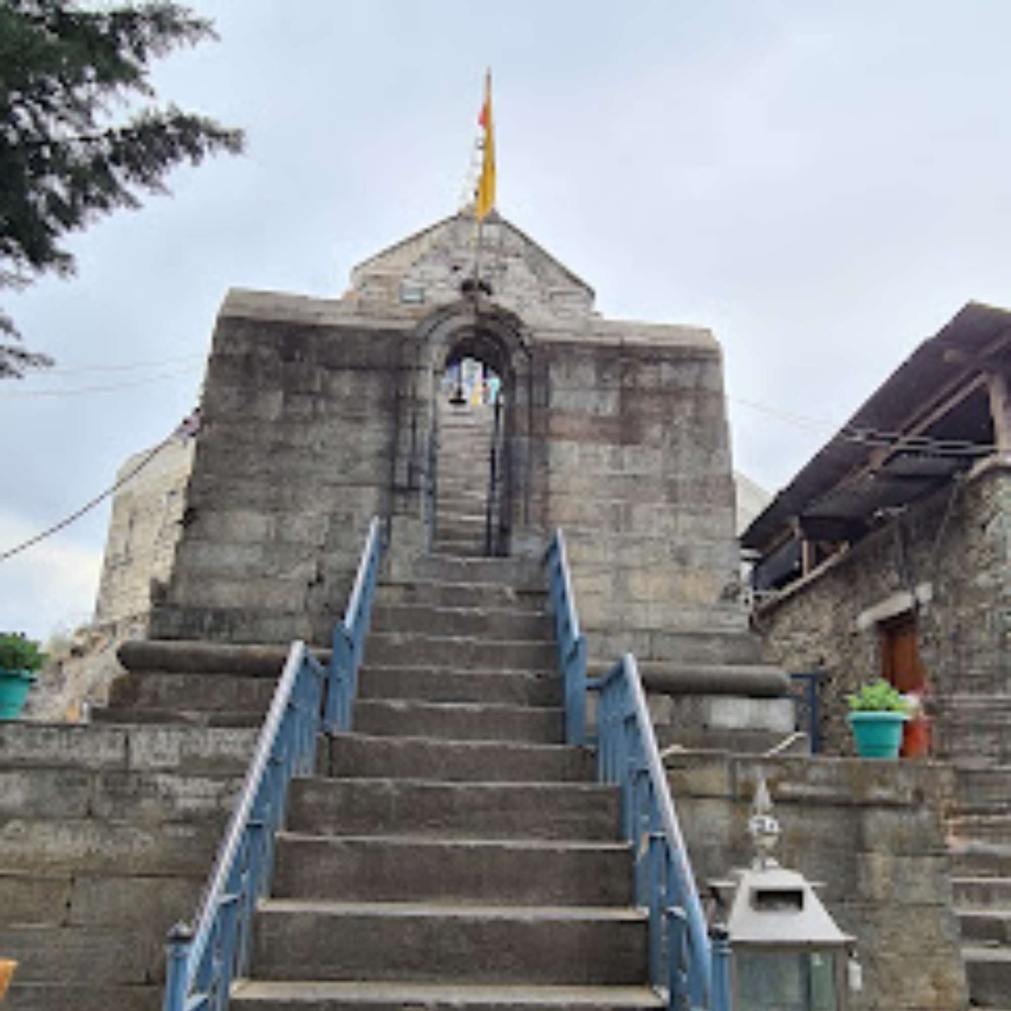 Stone steps climbing the hill to Shankaracharya Temple, broken by landings