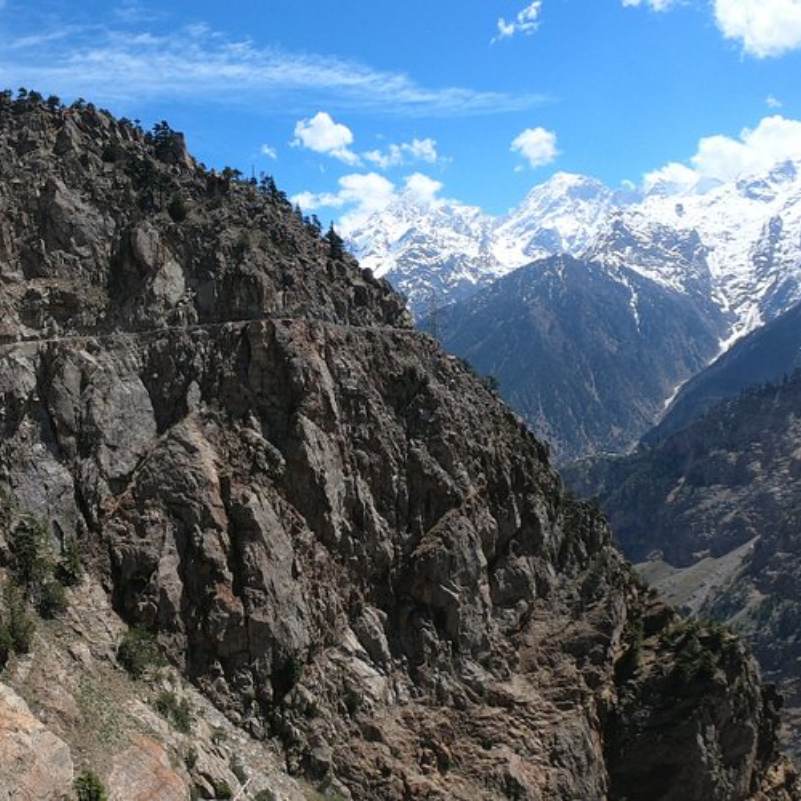 Deep valley and rocky cliffs viewed from Suicide Point Kalpa