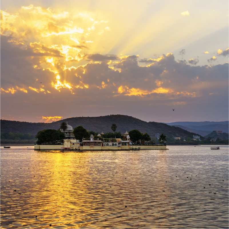 Golden sunset reflecting over Lake Pichola in Udaipur.jpg