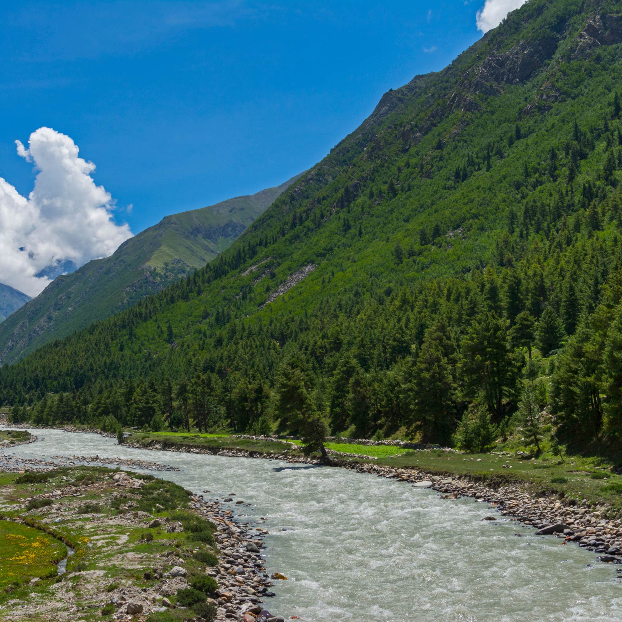 Baspa River flowing through Sangla Valley with mountains on both sides