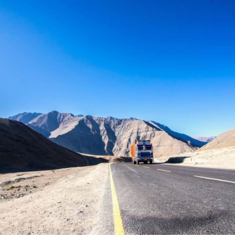 The curious slope at Magnetic Hill near Leh with barren mountains in the background