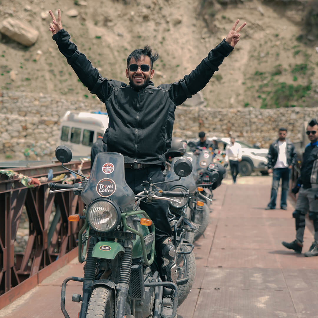Group bike ride on bridge during Travel Coffee Spiti Valley bike trip.jpg.jpeg