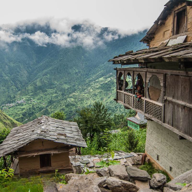 Traditional slate roofed homes in Gushaini village in Tirthan Valley
