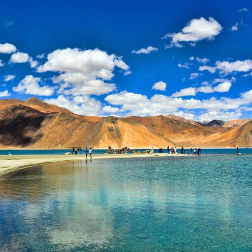 Snow dusted peaks rising behind Pangong Lake on the Tibet side, the mountain wall that defines the far shore