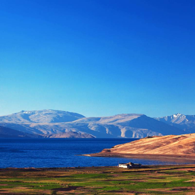 Turquoise waters beneath dramatic hills Tso Moriri Lake.jpg