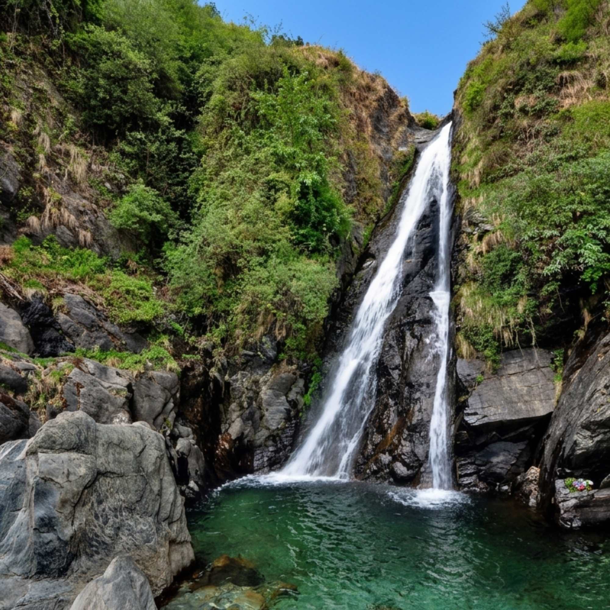 Stunning cascading water view of Bhagsu Waterfall in the Himalayas.jpg
