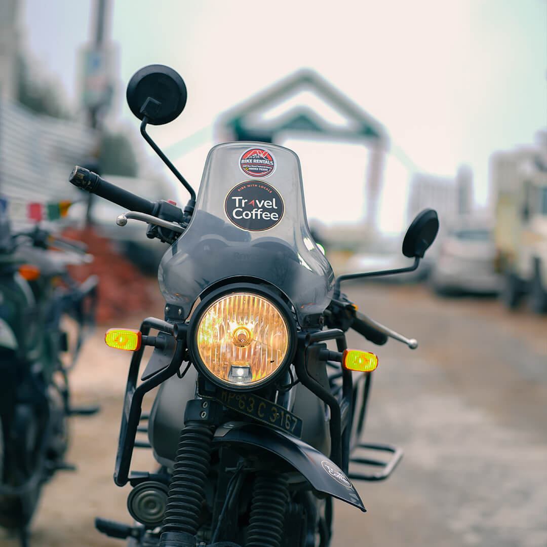 Travel Coffee sticker on Royal Enfield 411 bike during Himalayan bike expedition.jpg.jpeg