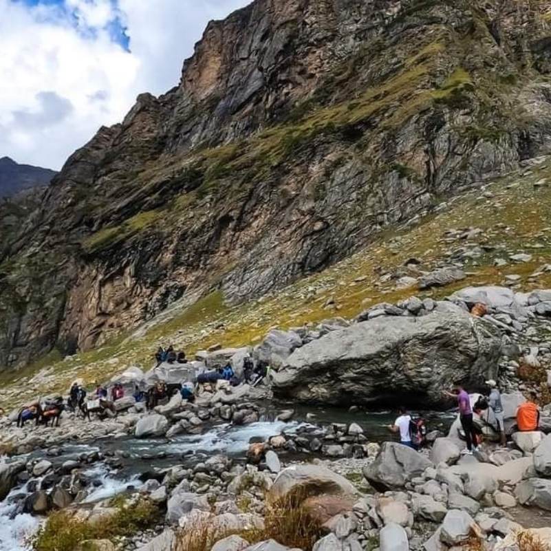 Rocky trail and boulders on the approach to Hampta Pass