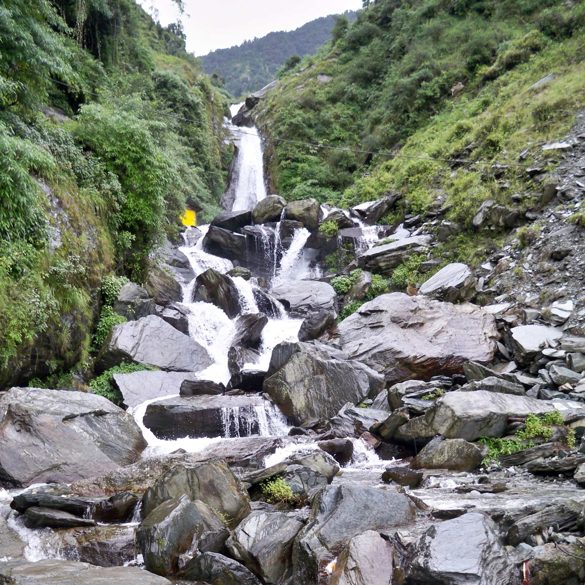 Bhagsu Waterfall near McLeod Ganj surrounded by lush greenery.jpg