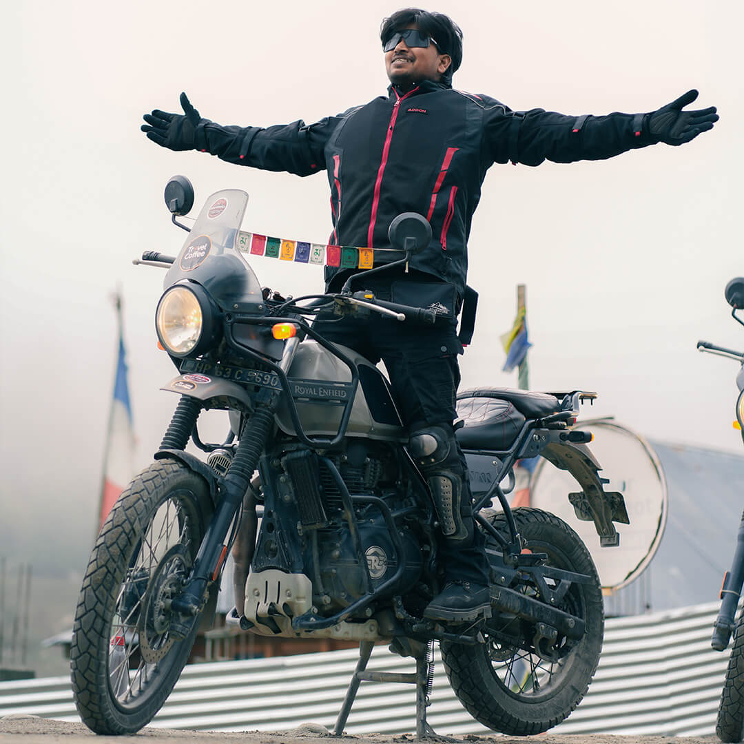 Rider standing on Royal Enfield Himalayan during Travel Coffee Spiti bike expedition.jpg.jpeg