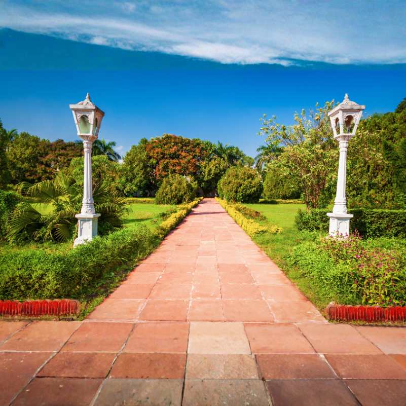 Peaceful walkway inside Saheliyon Ki Bari garden.jpg