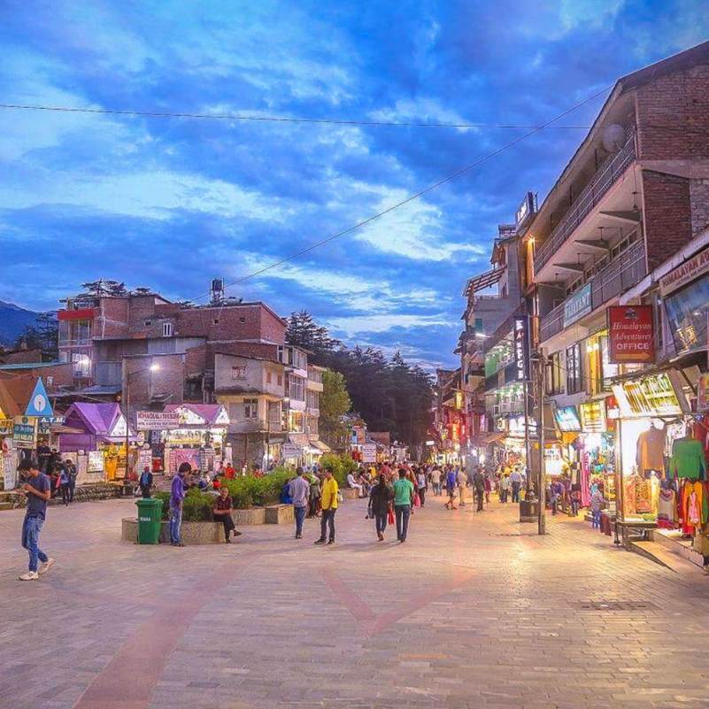 Tourists walking along the lively Mall Road in Manali.jpg
