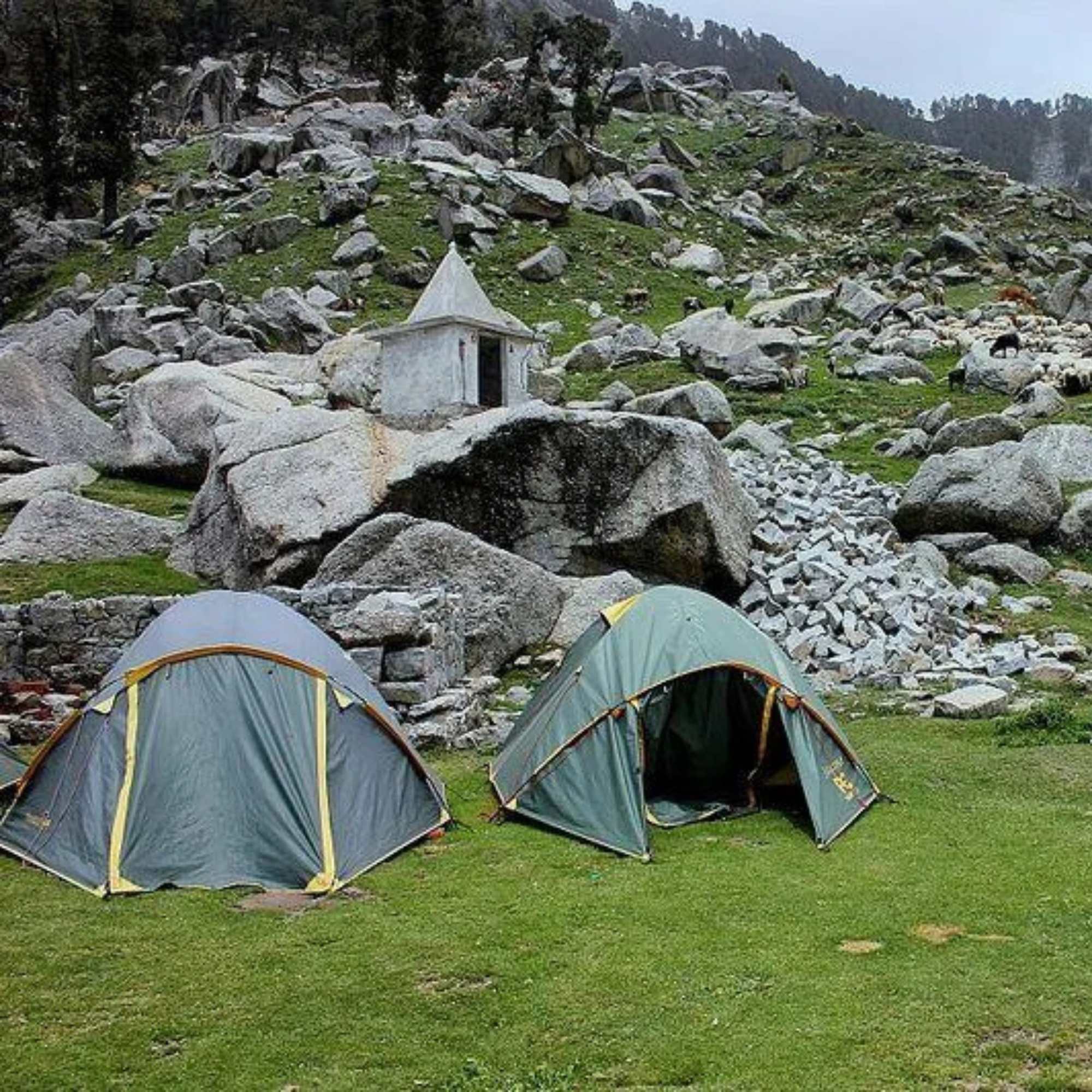 Camp site during Indrahar Pass Trek with scenic mountain backdrop.jpg