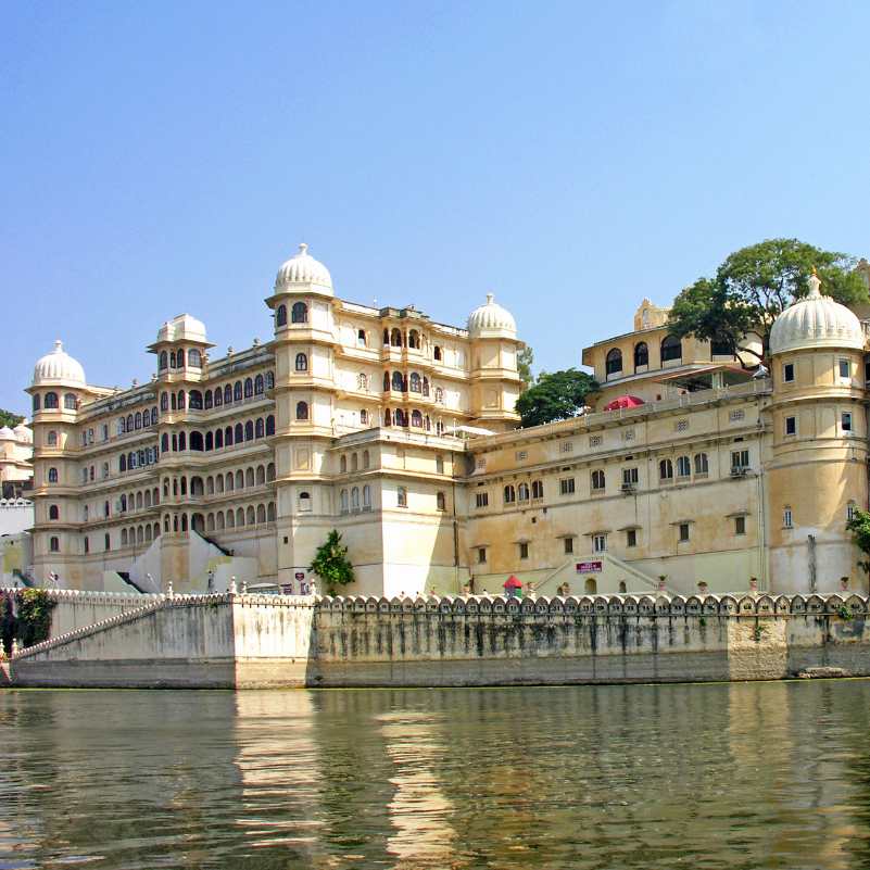 Tourists exploring Jag Mandir Palace on Lake Pichola.jpg